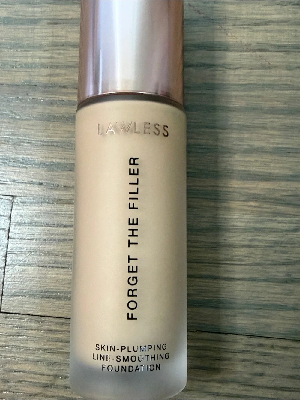 LAWLESS Foundation Bottle in Light Beige with Rose Gold Cap